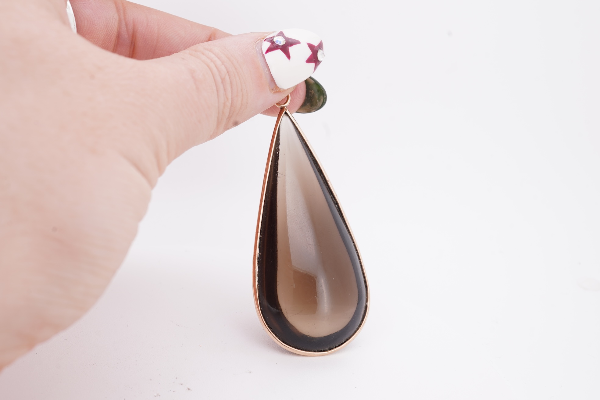A yellow metal mounted pear shaped smoky quartz set drop pendant, overall 59mm.